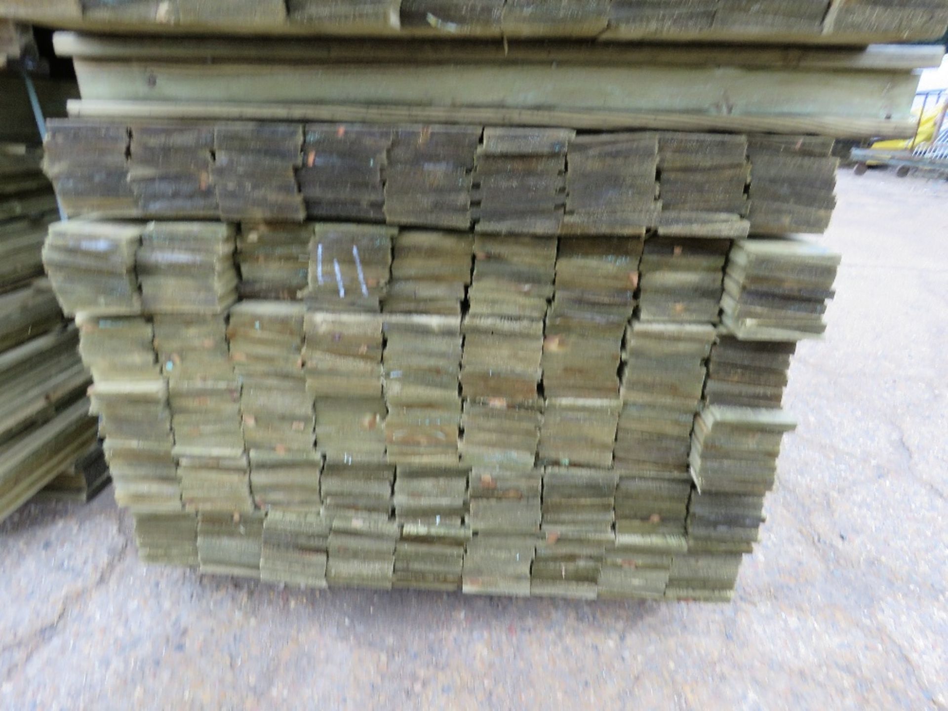 LARGE PACK OF TREATED FEATHER EDGE FENCE CLADDING TIMBERS 1.8M X 10CM APPROX.