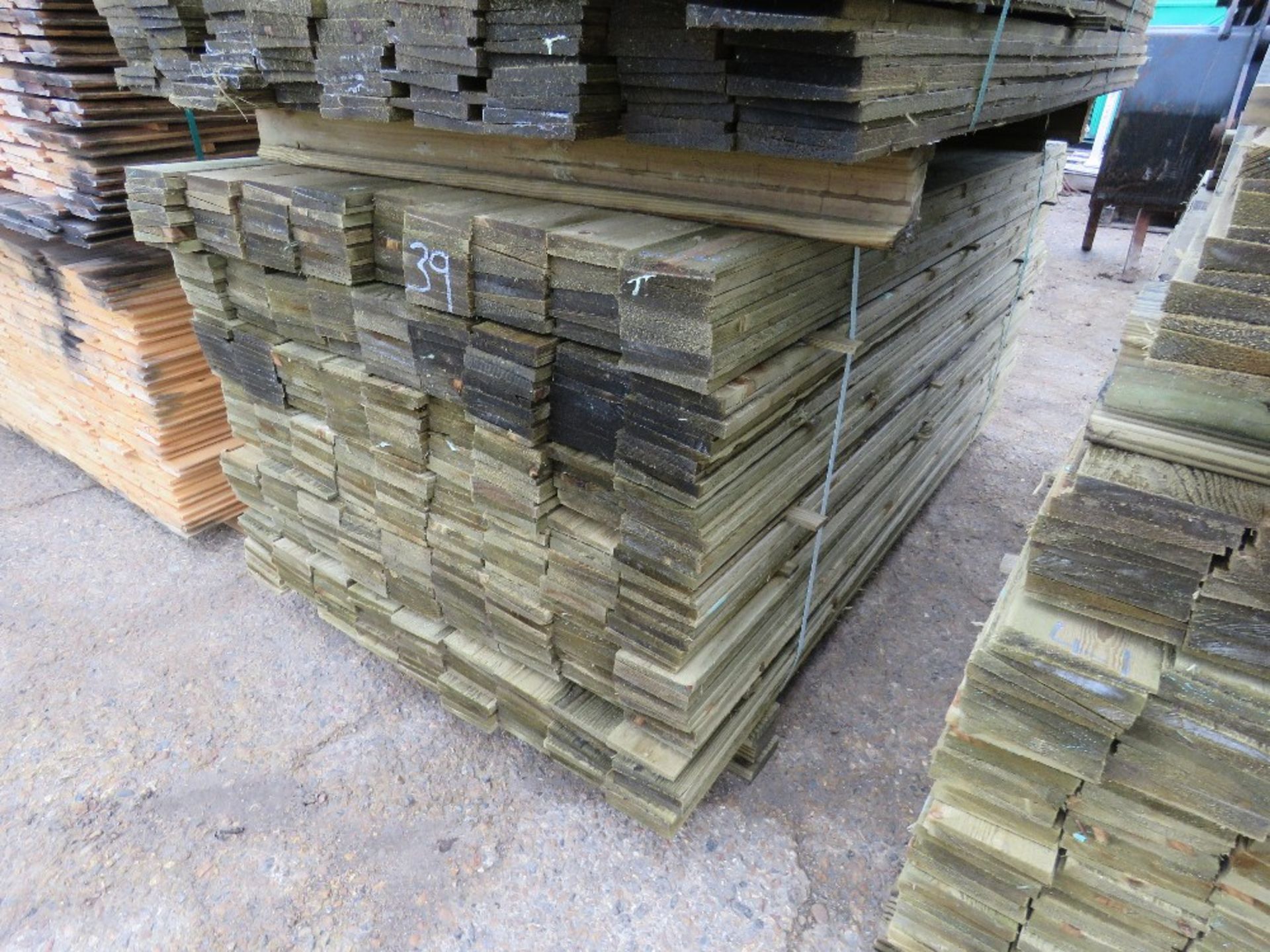 LARGE PACK OF TREATED FEATHER EDGE FENCE CLADDING TIMBERS 1.8M X 10CM APPROX. - Image 2 of 3
