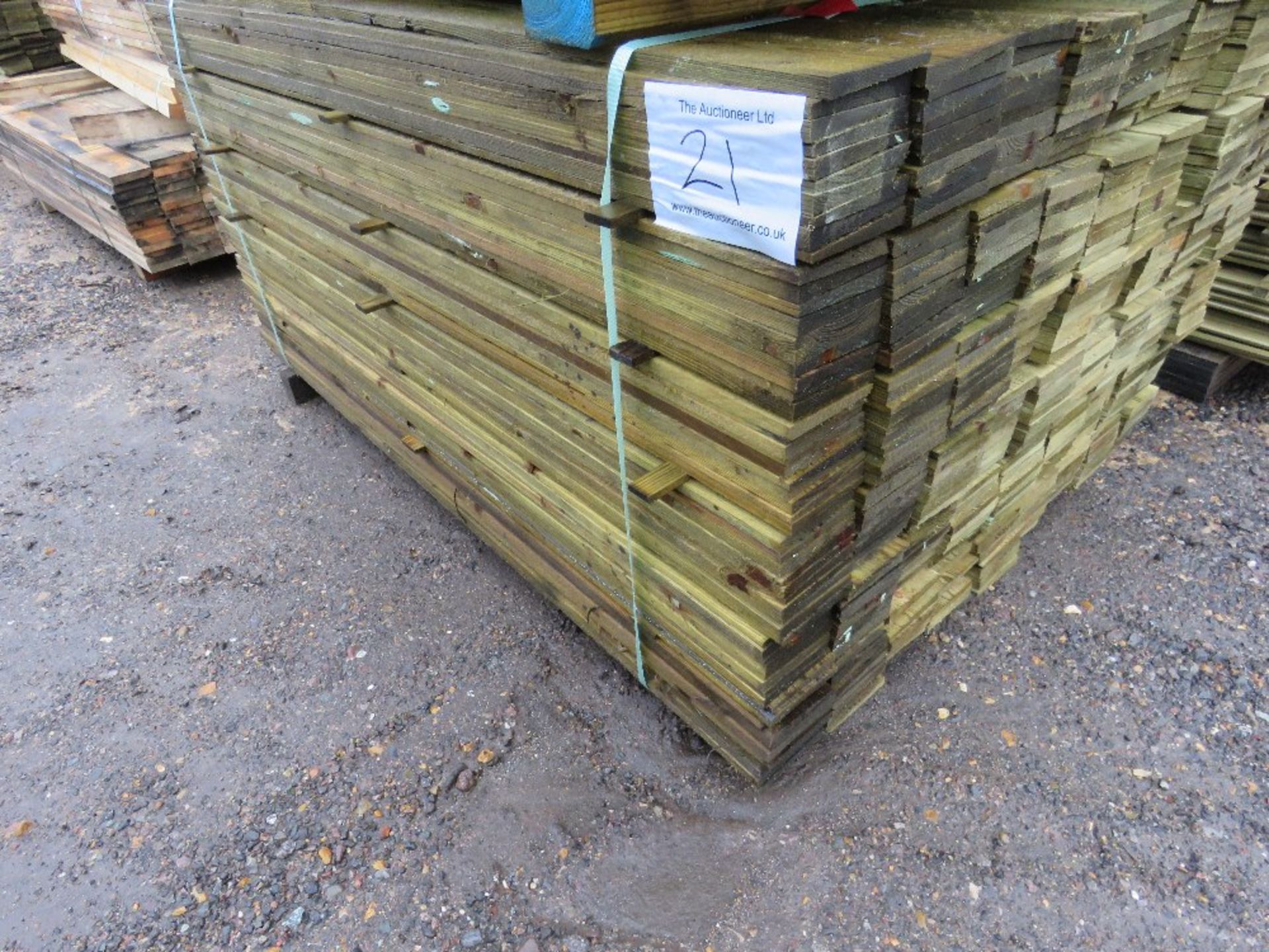 PACK OF TREATED FEATHER EDGE FENCE CLADDING BOARDS. 1.5M X 10CM APPROX. - Image 3 of 5