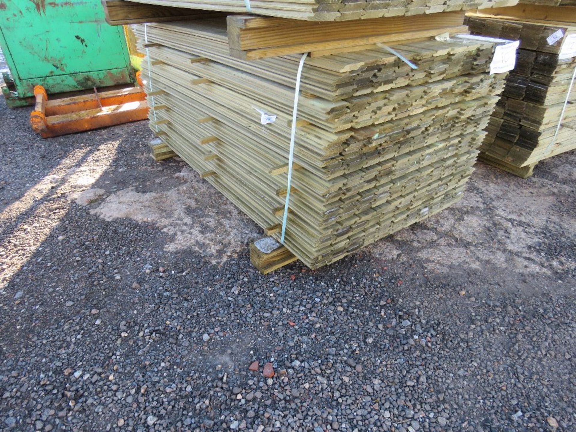 LARGE PACK OF TREATED SHIPLAP FENCE CLADDING TIMBERS. 1.73M X 10CM WIDTH APPROX.