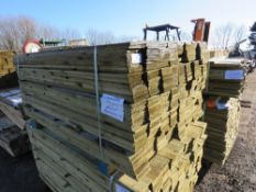 PACK OF TREATED FEATHER EDGE FENCE CLADDING BOARDS. 1.5M X 10CM APPROX.