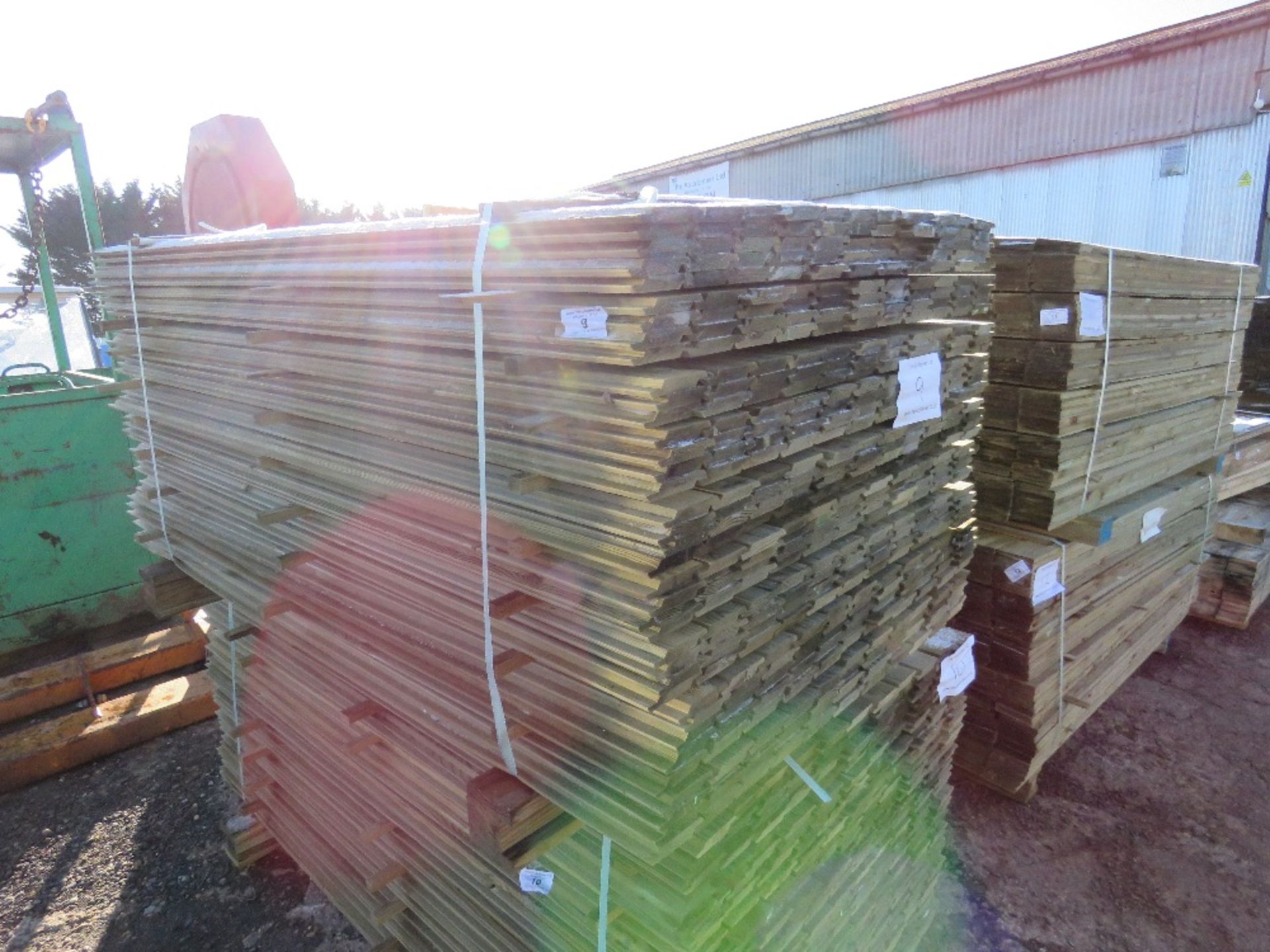 LARGE PACK OF TREATED SHIPLAP FENCE CLADDING TIMBERS. 1.73M X 10CM WIDTH APPROX.