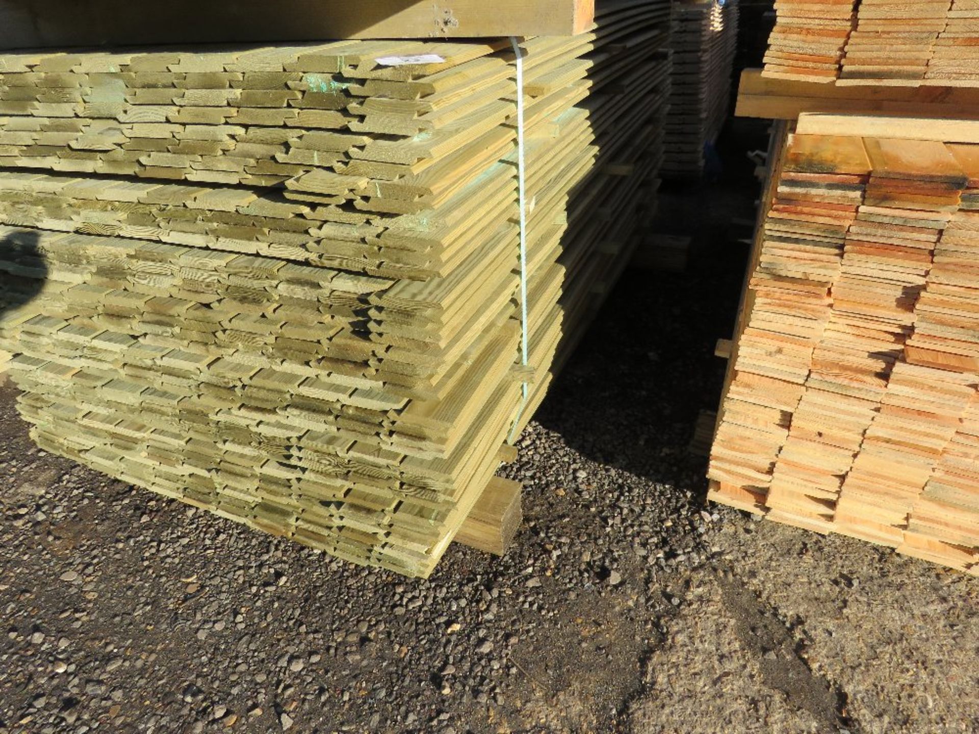 PACK OF TREATED SHIPLAP FENCE CLADDING BOARDS. 1.73M X 10CM APPROX.