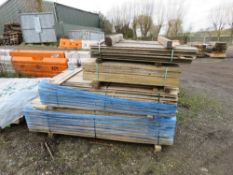 STACK OF ASSORTED SHIPLAP AND FLAT CLADDING BOARDS.