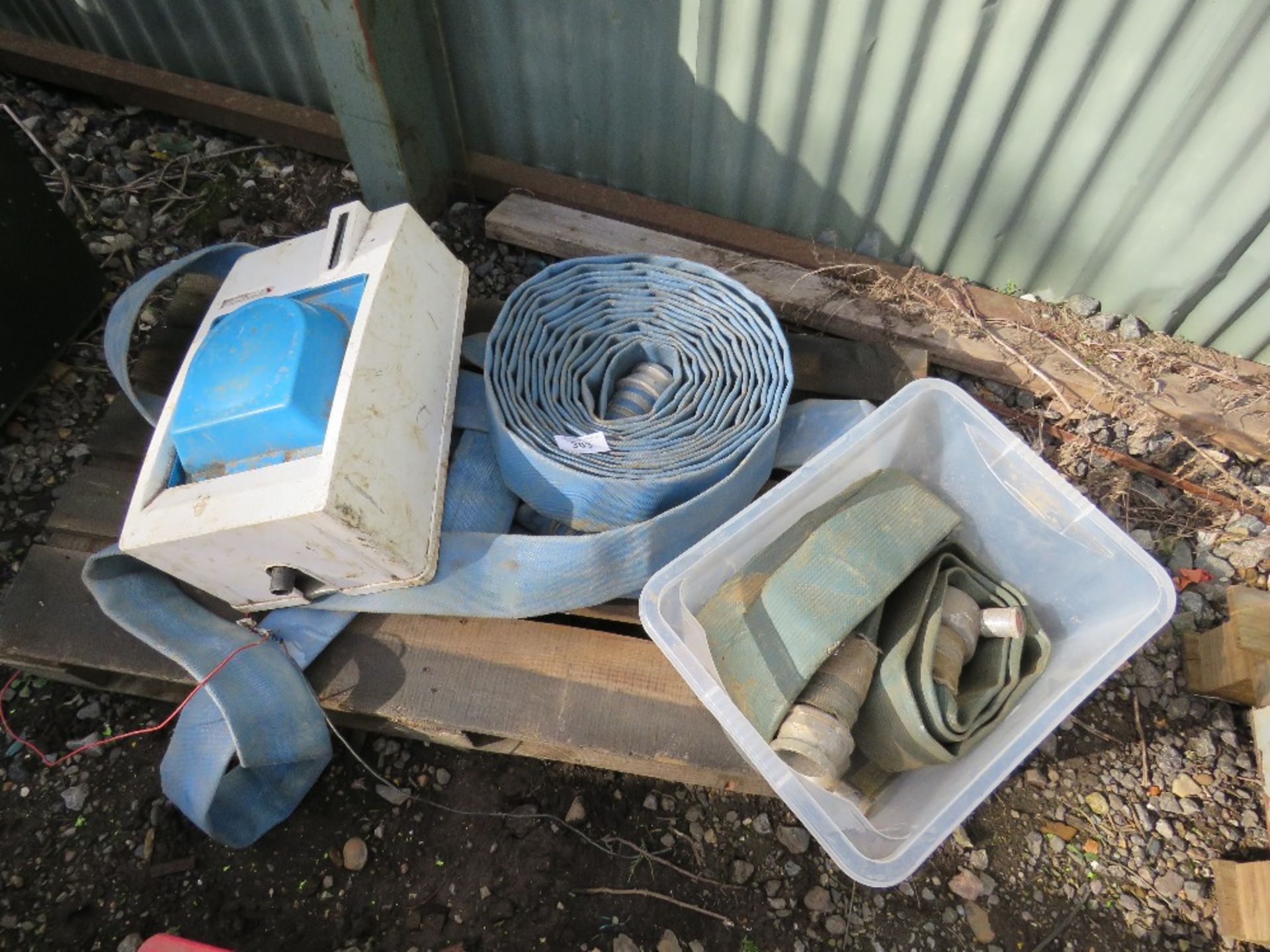 PALLET OF HOSES AND A HAND WASH UNIT.