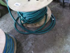 LARGE ROLL OF WATER HOSE PIPE.