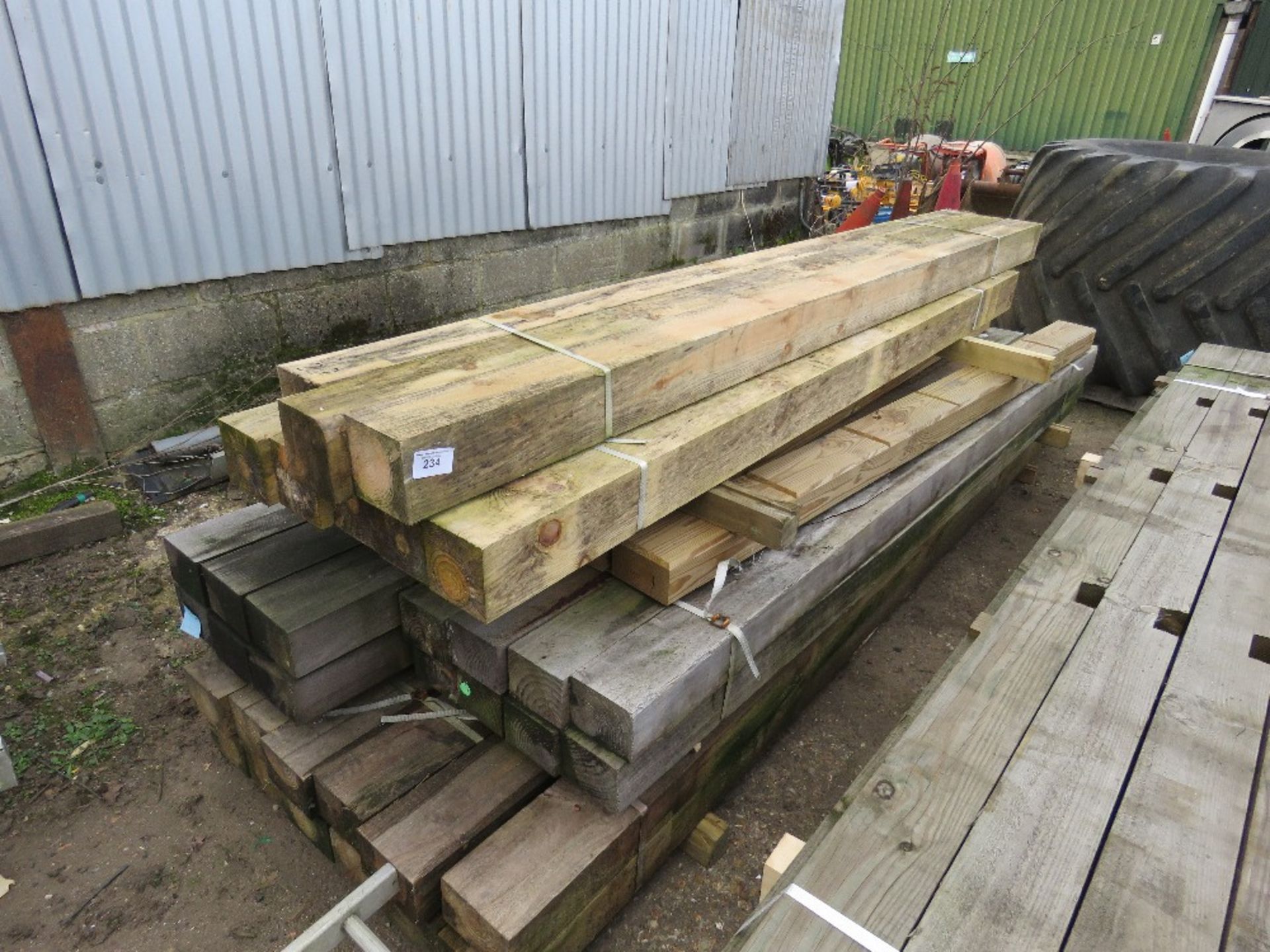 STACK OF TIMBER POSTS 2.4-3.3METRES APPROX.