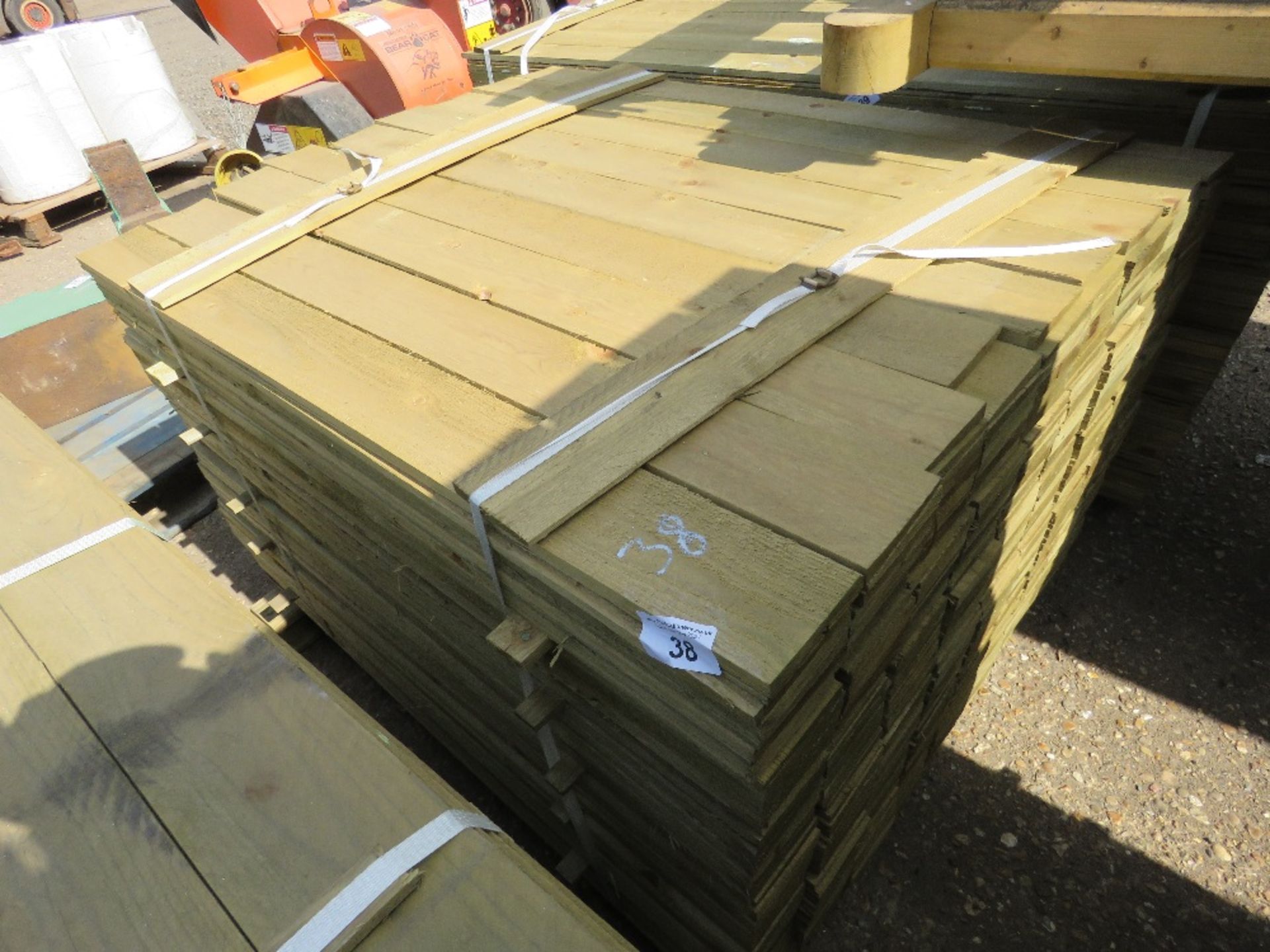LARGE PACK OF FEATHER EDGE CLADDING TIMBER 1.2M X 10CM APPROX, PRESSURE TREATED.