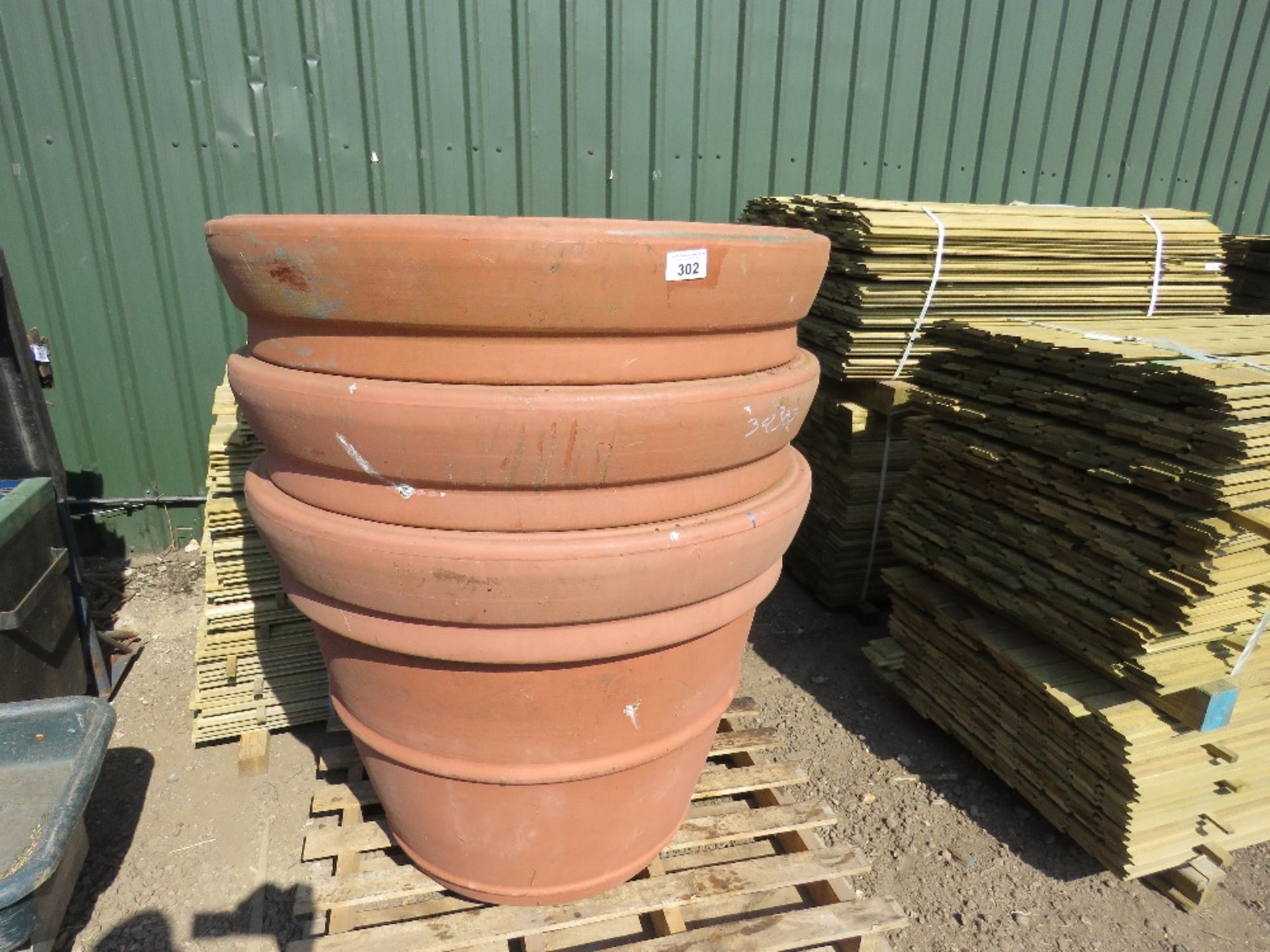 3 X EXTRA LARGE PLASTIC PLANT POTS 87CM HEIGHT X 110CM DIAMETER APPROX, PLUS SOME OTHERS INSIDE.