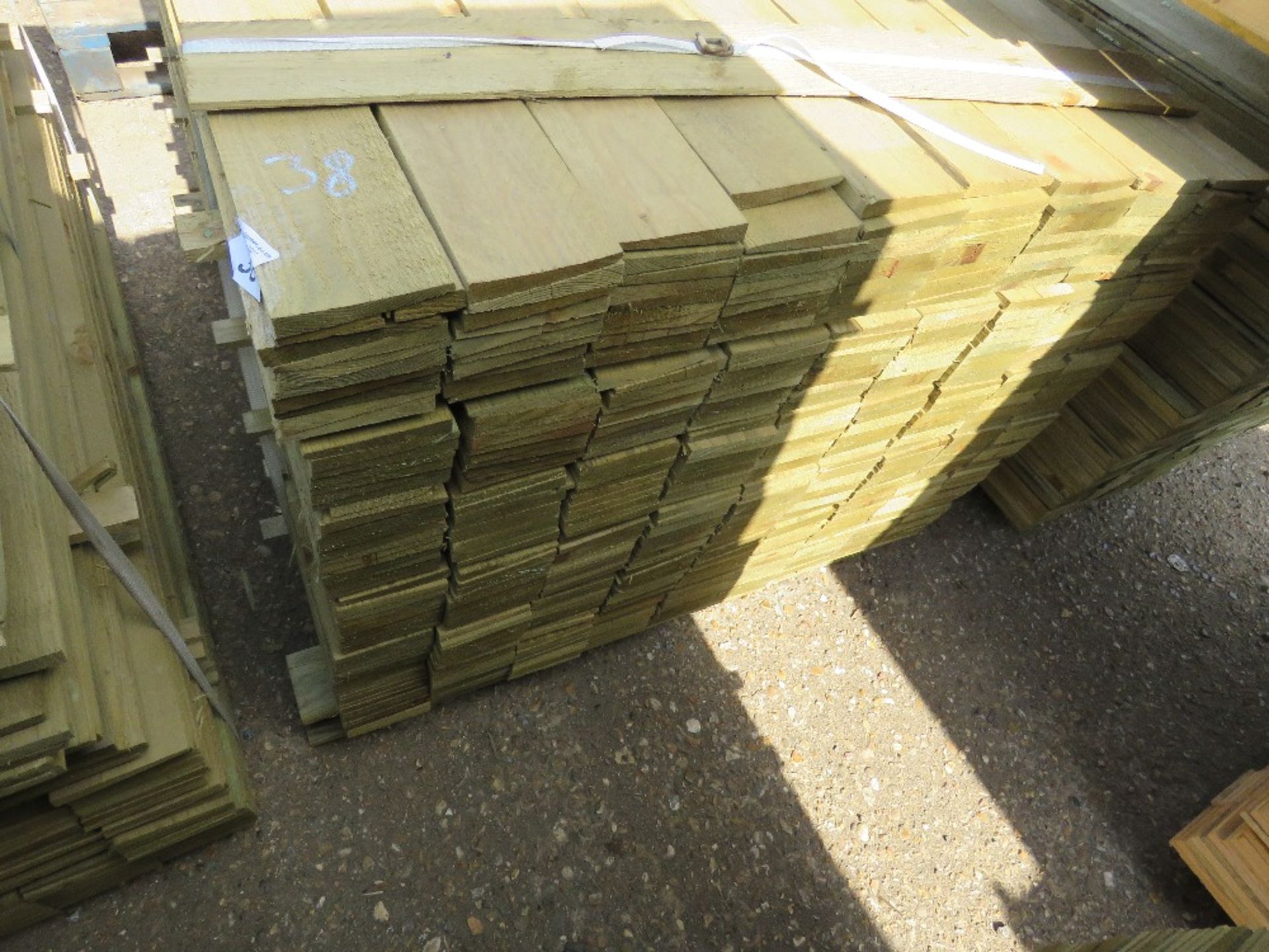 LARGE PACK OF FEATHER EDGE CLADDING TIMBER 1.2M X 10CM APPROX, PRESSURE TREATED. - Image 3 of 4