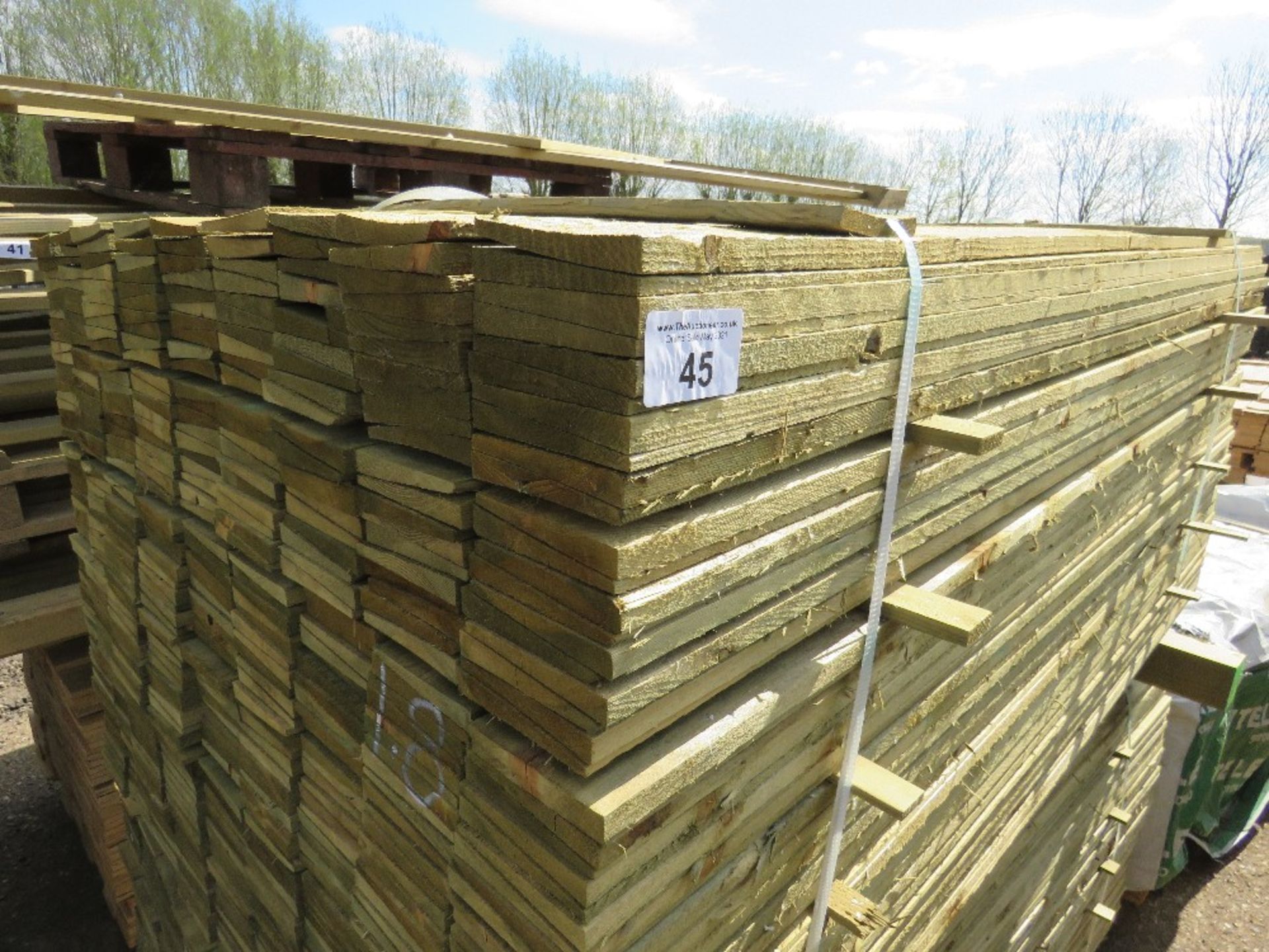 LARGE PACK OF FEATHER EDGE CLADDING TIMBER 1.8M X 10CM APPROX, PRESSURE TREATED.