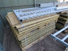 STACK OF ASSORTED FENCE PANELS.