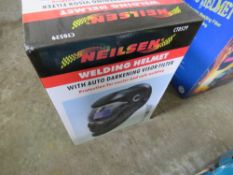 AUTO DARKENING WELDING HELMET IN BOX.