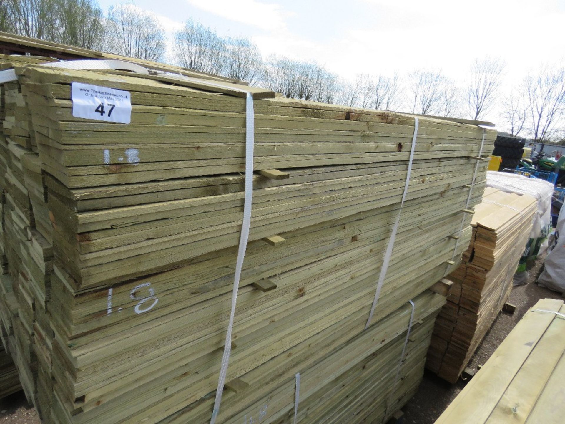 LARGE PACK OF FEATHER EDGE CLADDING TIMBER 1.8M X 10CM APPROX, PRESSURE TREATED.