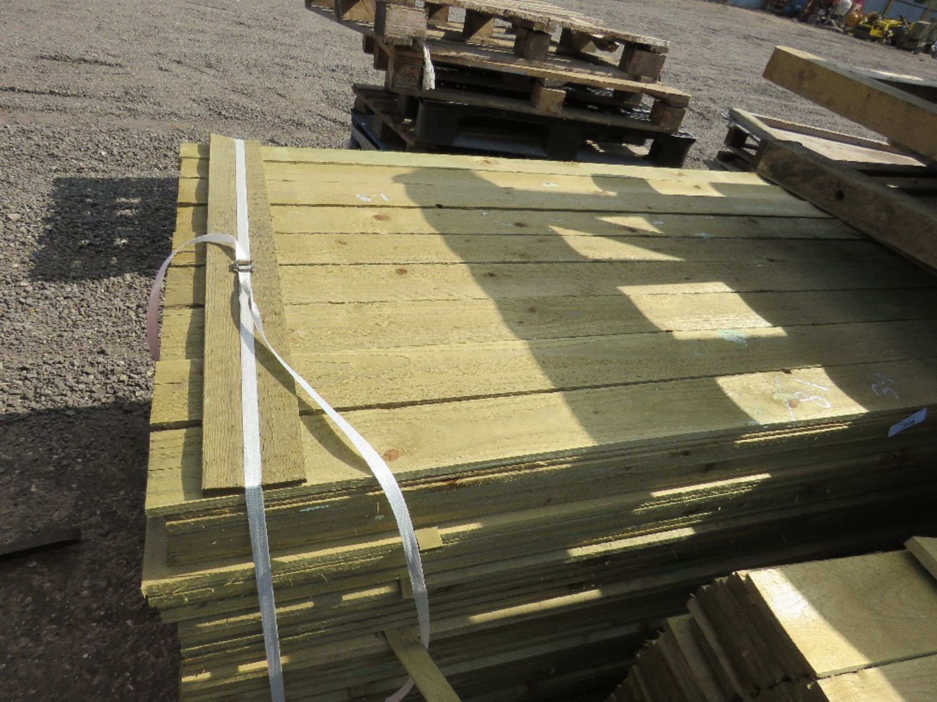 LARGE PACK OF FEATHER EDGE CLADDING TIMBER 1.8M X 10CM APPROX, PRESSURE TREATED.