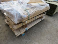 STACK OF MIXED TIMBER FENCE TIMBERS AND SLATS. SHIP LAP AND MACHINED RAILS, UNTREATED.