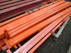 STACK OF ORANGE RACKING BEAMS @2.7M LENGTH.