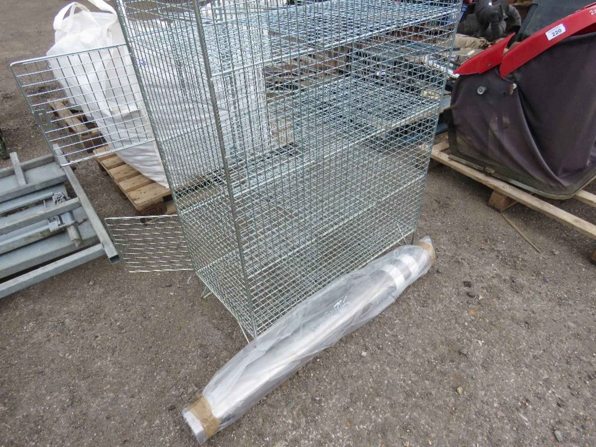 METAL CAGE LOCKER PLUS A METAL BOLLARD.