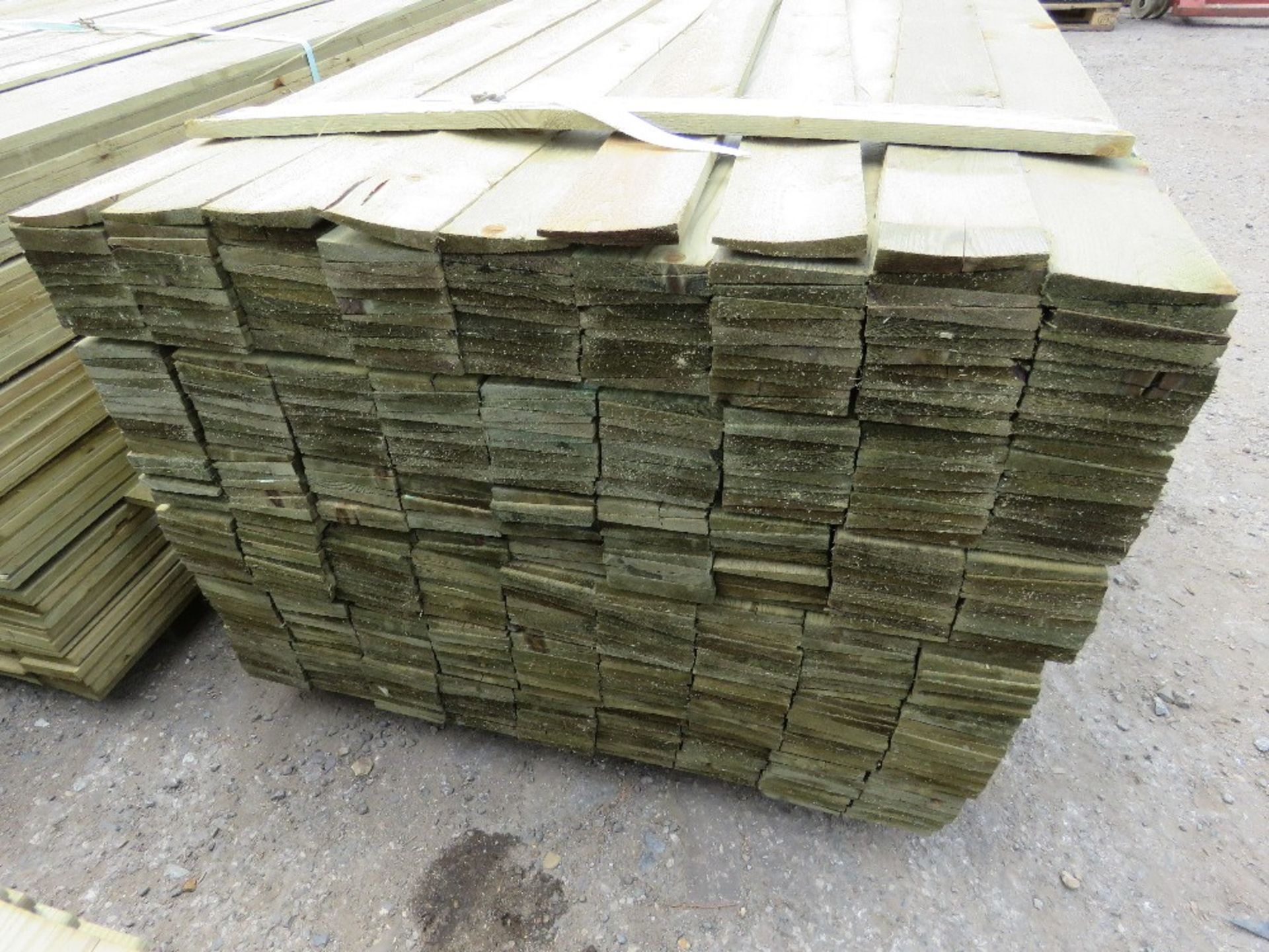 LARGE PACK OF TREATED FEATHER EDGE TIMBER CLADDING 1.65M X 10CM APPROX. - Image 2 of 3