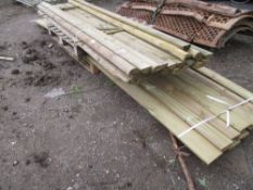 PALLET OF LONG FENCING RAILS AND CLADDING BOARDS.