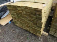 LARGE PACK OF FEATHER EDGE TREATED TIMBER, 1.49M X 10CM APPROX.