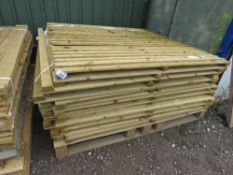 STACK OF APPROXIMATELY 17 X FEATHER EDGE CLAD FENCE PANELS.