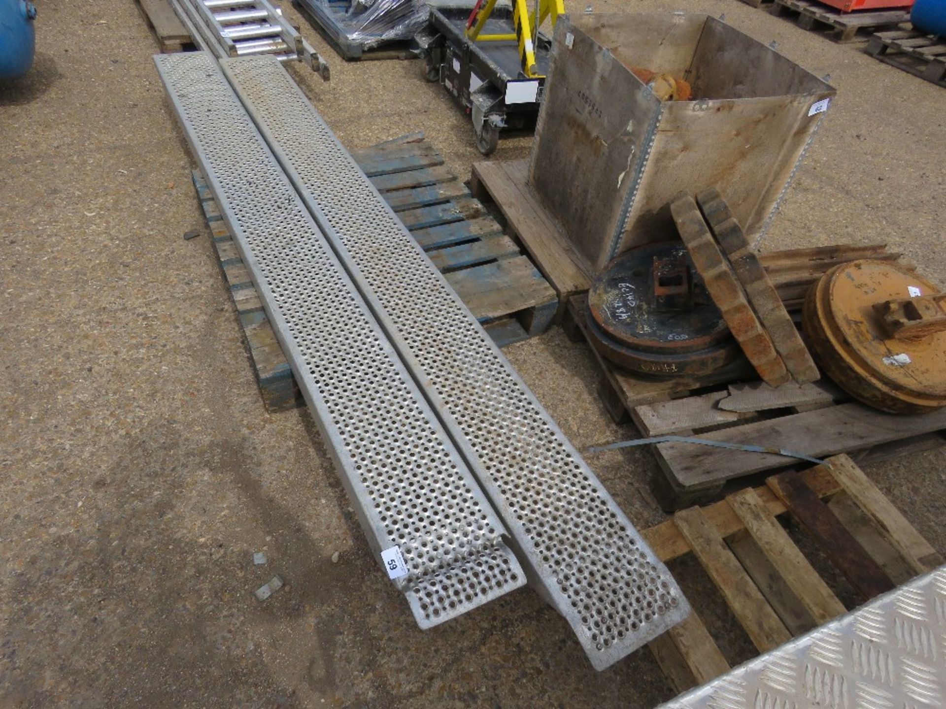 PAIR OF LOADING RAMPS, 9FT LENGTH APPROX, DAMAGE ON ONE END.
