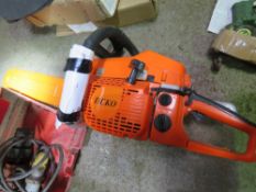 DEKO PETROL ENGINED CHAINSAW, UNUSED.