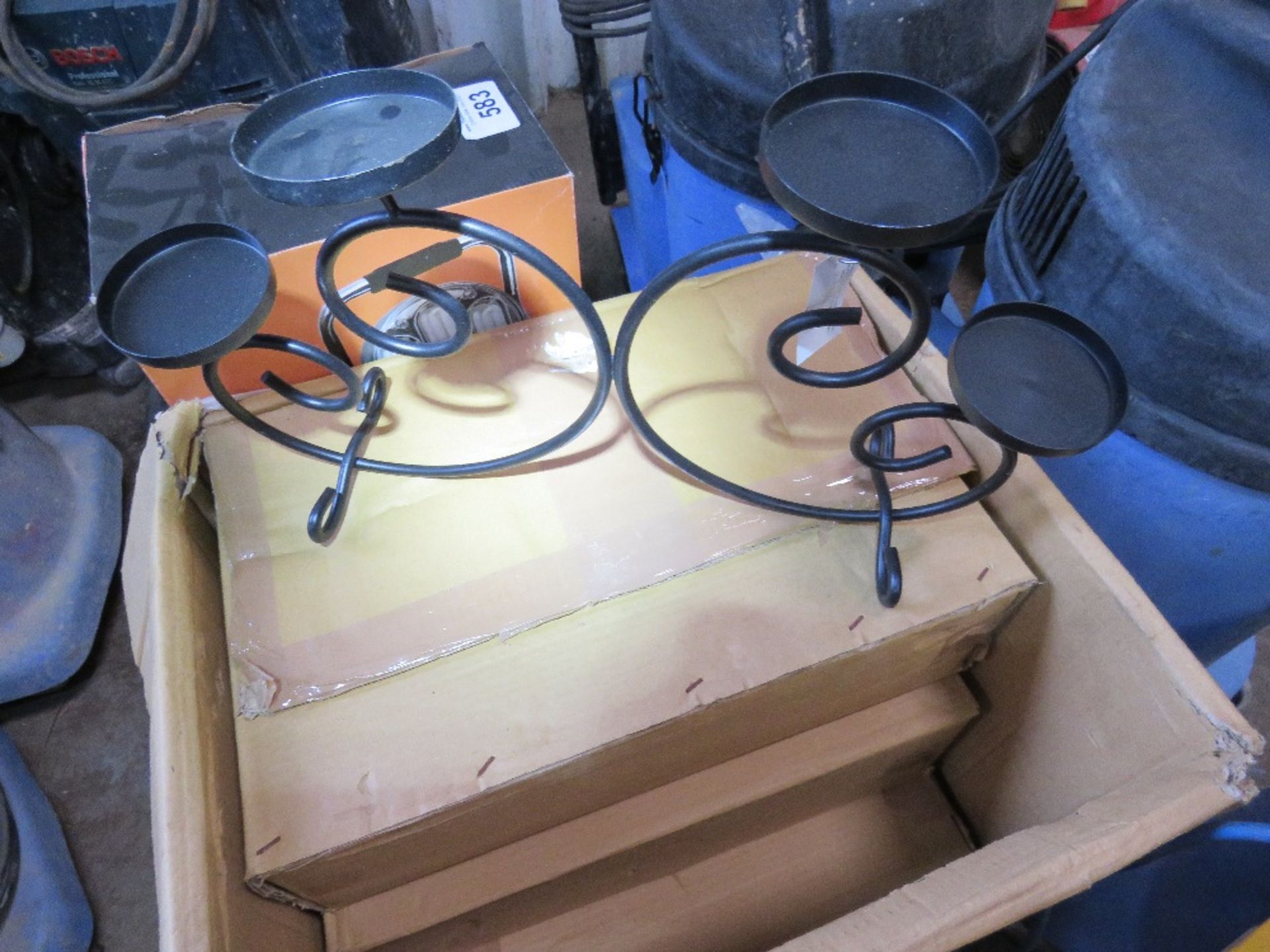 LARGE BOX OF DECORATIVE TEA LIGHT HOLDERS.