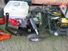 PETROL ENGINED PRESSURE WASHER WITH HOSE AND LANCE.