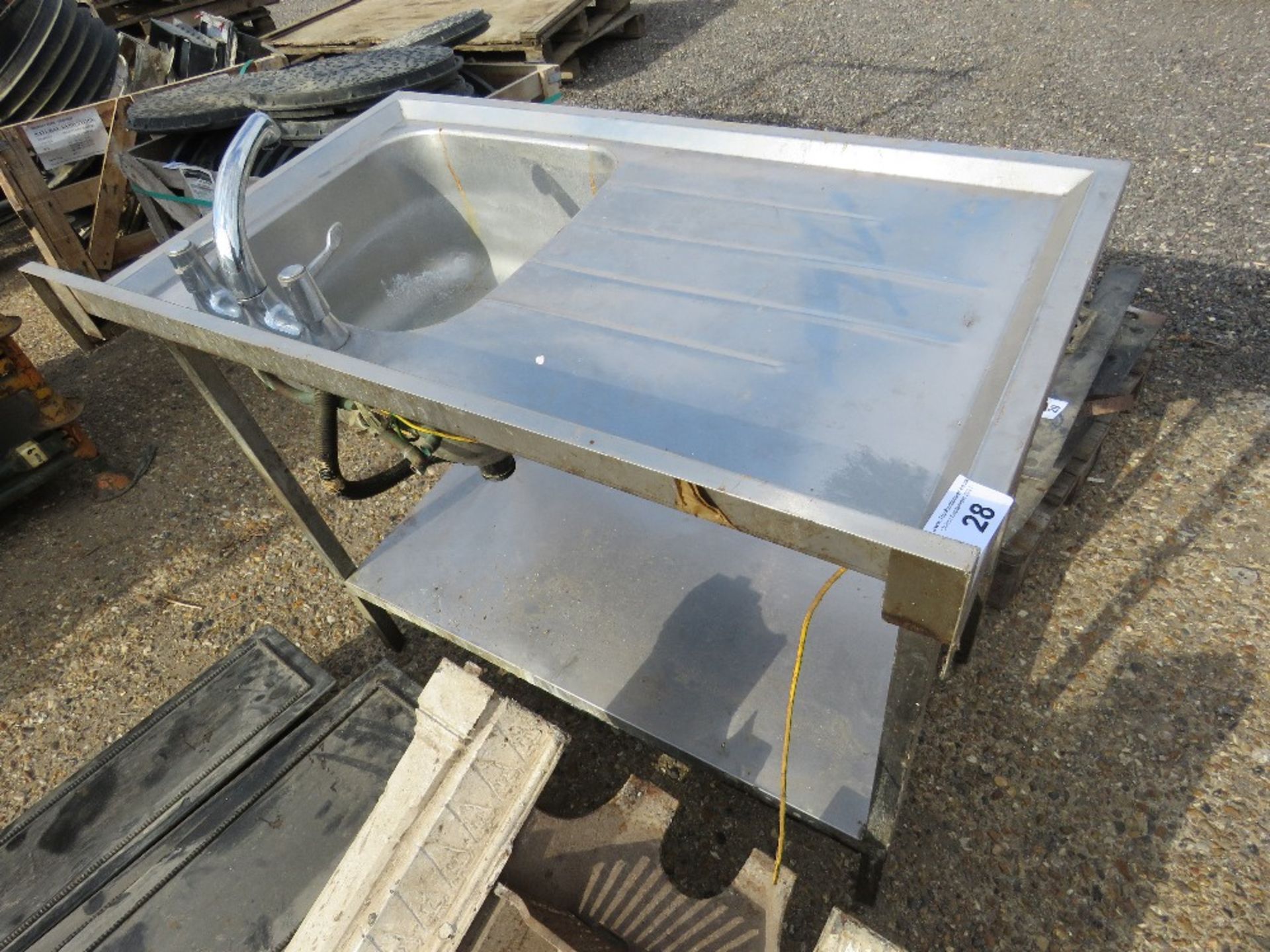 STAINLESS STEEL SINK WITH TAPS.