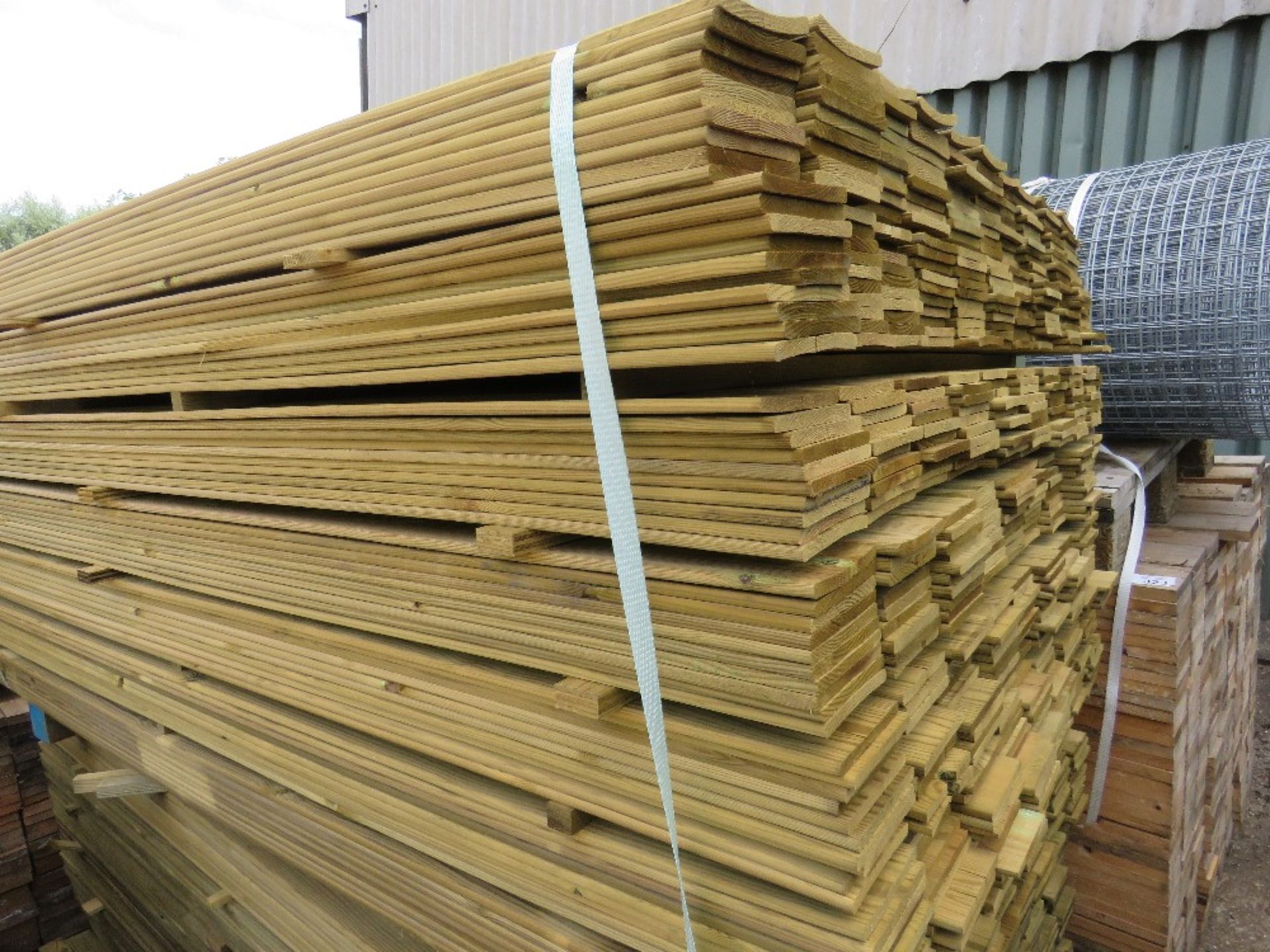 LARGE PACK OF TREATED HIT AND MISS FENCE CLADDING TIMBER BOARDS, 1.75 M LENGTH X 10CM WIDTH APPROX.