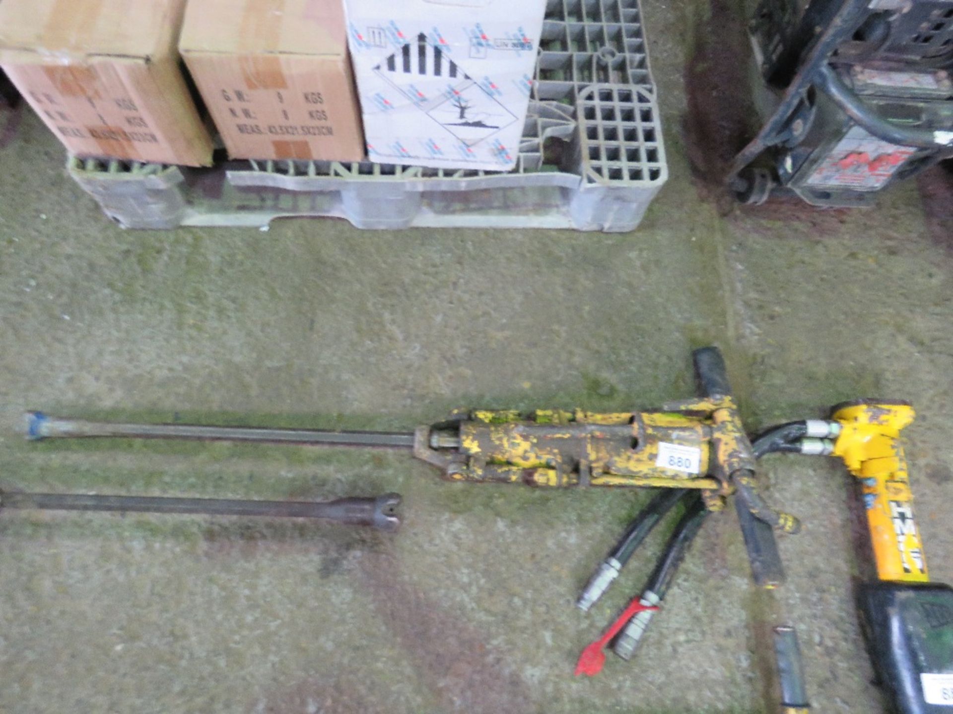 AIR POWERED ROCK DRILL WITH LONG DRILL BIT.