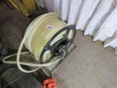CLEAR HOSE REEL ON STAND. SOURCED FROM COMPANY LIQUIDATION.