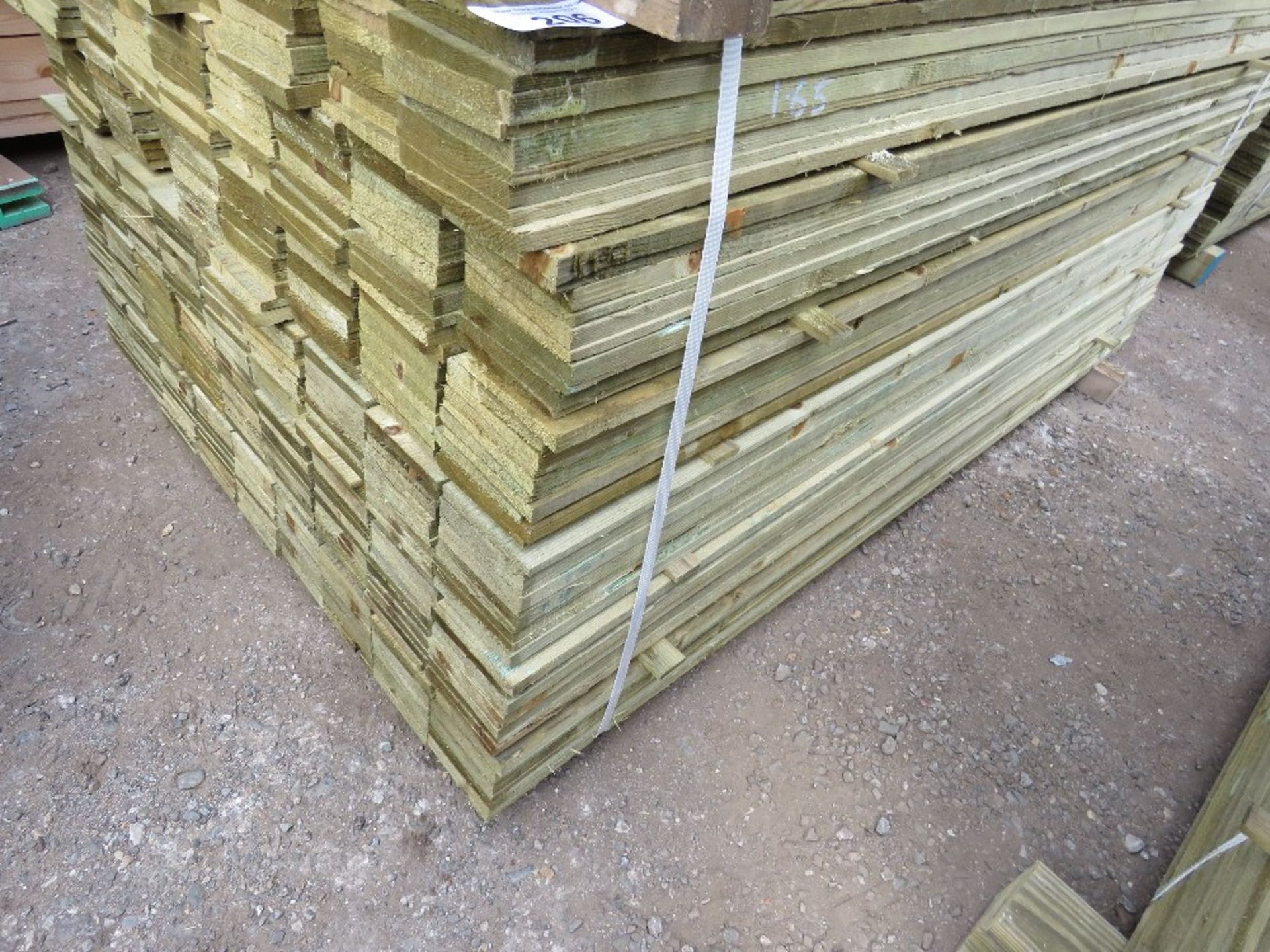 LARGE PACK OF PRESSURE TREATED FEATHER EDGE TIMBER FENCE CLADDING BOARDS. SIZE: 1.65M LENGTH,