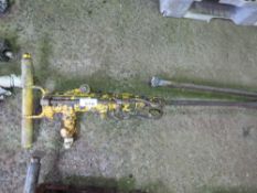 AIR POWERED ROCK DRILL WITH LONG DRILL BIT.