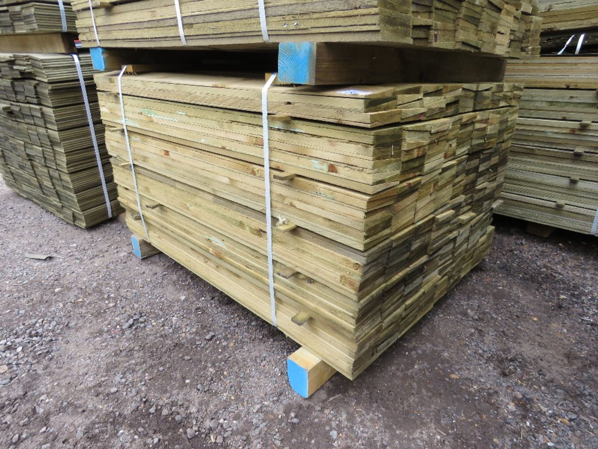 LARGE PACK OF TREATED FEATHER EDGE TIMBER CLADDING BOARDS, 1.2M LENGTH X 10CM WIDTH APPROX.