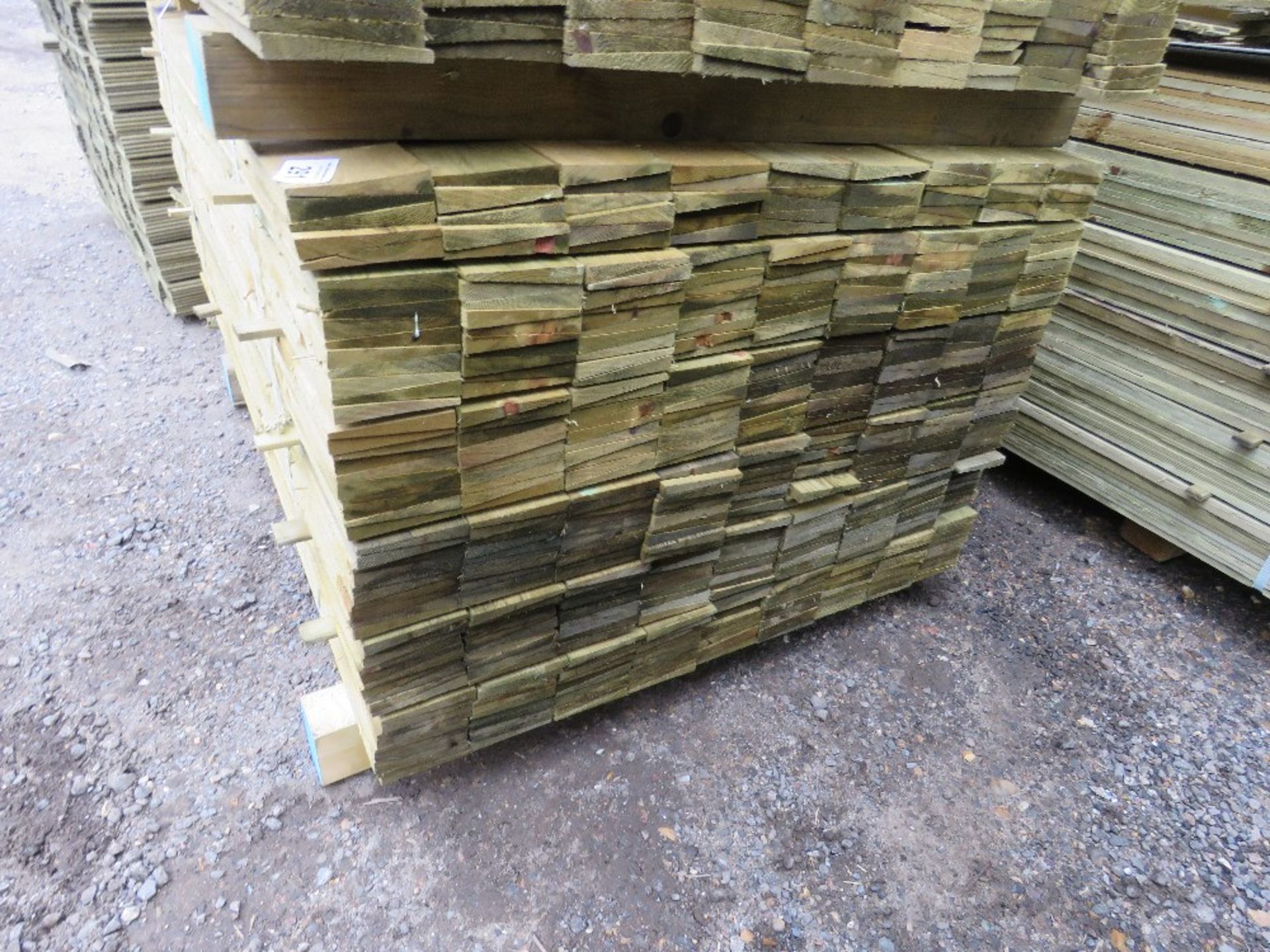 LARGE PACK OF TREATED FEATHER EDGE TIMBER CLADDING BOARDS, 1.2M LENGTH X 10CM WIDTH APPROX. - Image 2 of 5