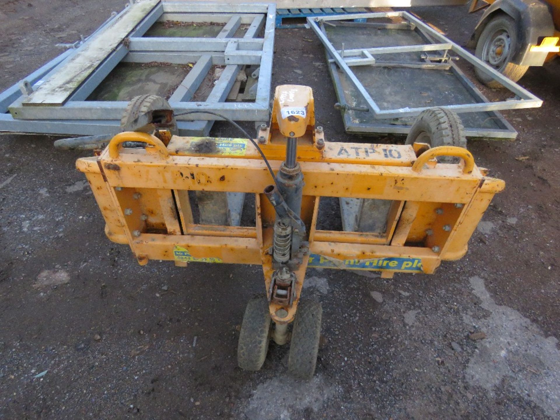 ROUGH TERRAIN PALLET TRUCK. WHEN TESTED WAS SEEN TO LIFT AND LOWER, HANDLE NEEDS REPAIR AS SHOWN. - Image 2 of 3