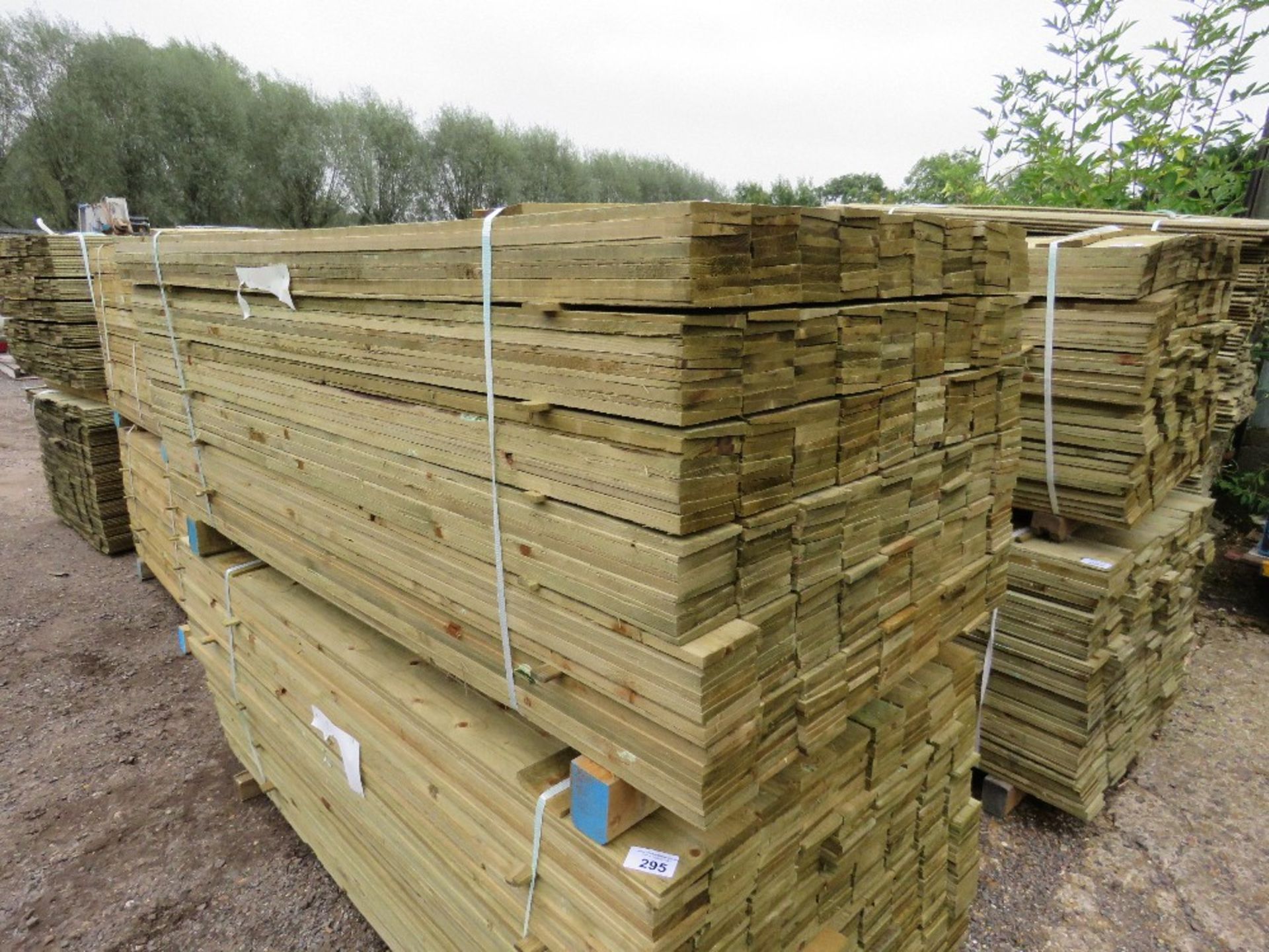 LARGE PACK OF TREATED FEATHER EDGE TIMBER CLADDING BOARDS, 1.80M LENGTH APPROX X 10CM WIDTH APPROX.