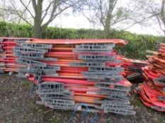 STACK OF APPROXIMATELY 32 X PLASTIC CHAPTER 8 BARRIERS.