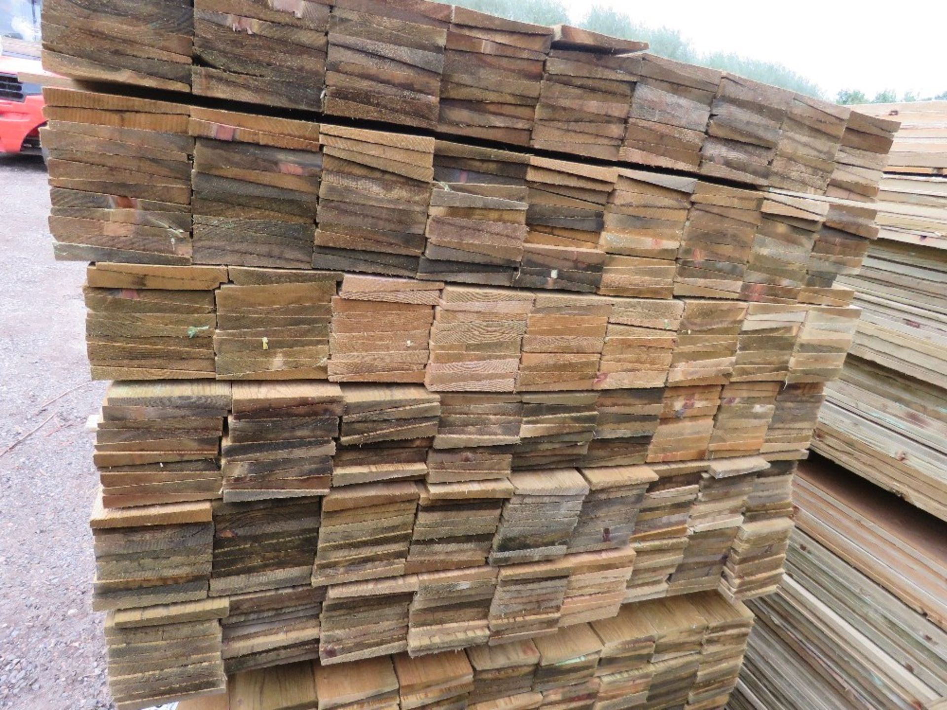 LARGE PACK OF TREATED FEATHER EDGE TIMBER CLADDING BOARDS, 1.2M LENGTH X 10CM WIDTH APPROX. - Image 3 of 4