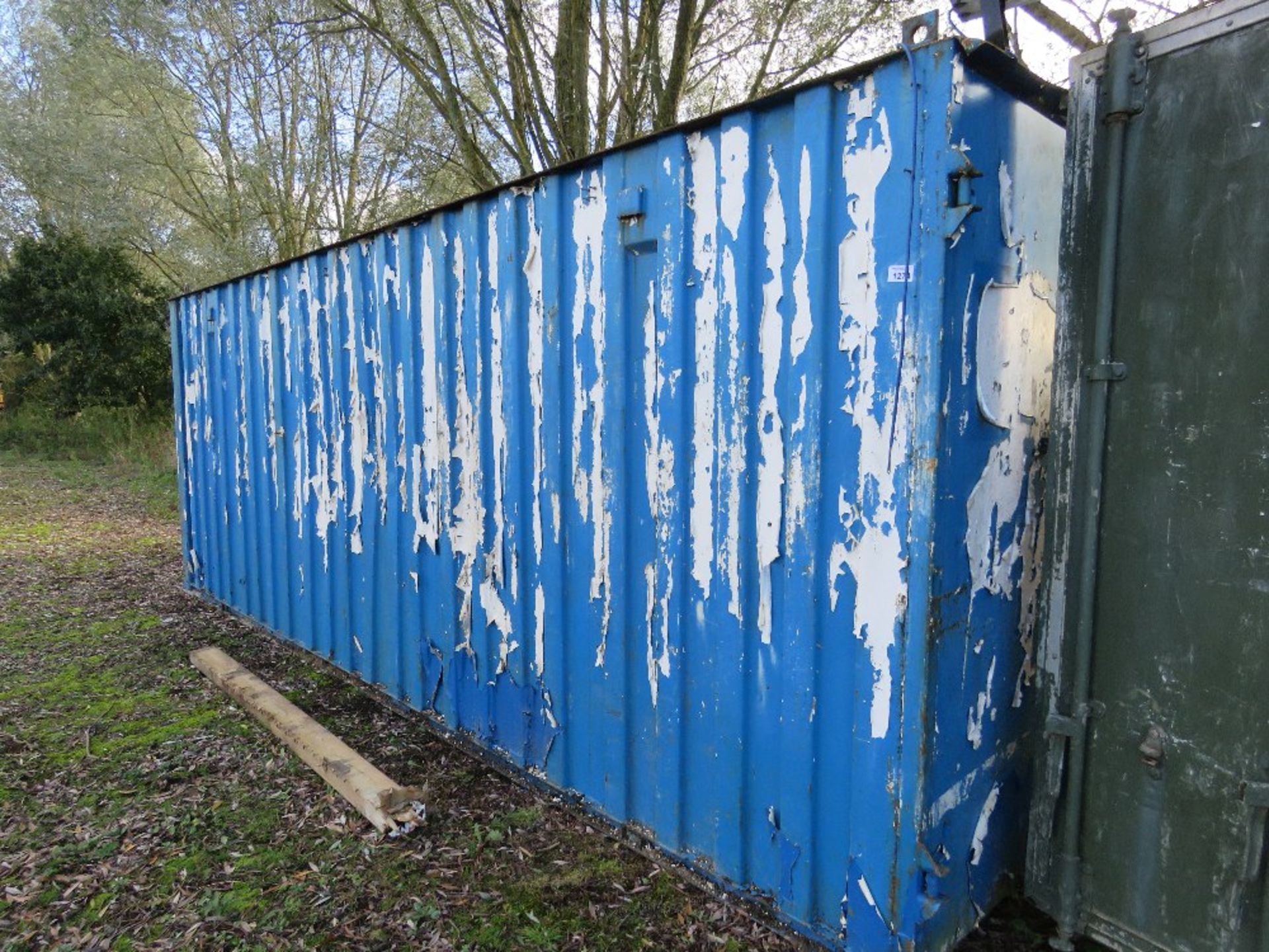 STEEL BLUE PAINTED SECURE CONTAINER STORE UNIT, 20FT LENGTH APPROX. WE CAN LIFT ONTO A SUITABLE VEHI