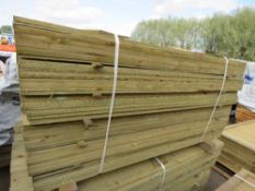LARGE PACK OF PRESSURE TREATED FEATHER EDGE TIMBER FENCE CLADDING BOARDS. SIZE: 1.50M LENGTH,