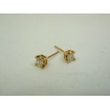 Pair of 9ct gold and diamond set stud earrings