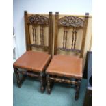 Pair of leather and beech dining chairs