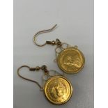 9ct gold fitments set with 1/10th krugerrand coins.