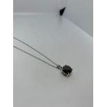 18ct white gold black diamond pendant on chain. 3.7g