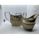 Silver milk jug and sugar basin