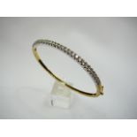 9ct gold CZ set hinged bangle.ï¿½